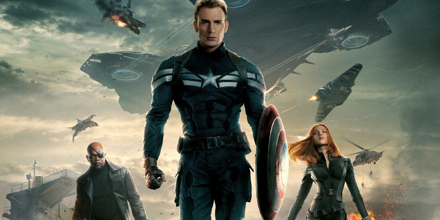 Nick Fury, Captain America, and Black Widow stand in front of a helicarrier explosion.