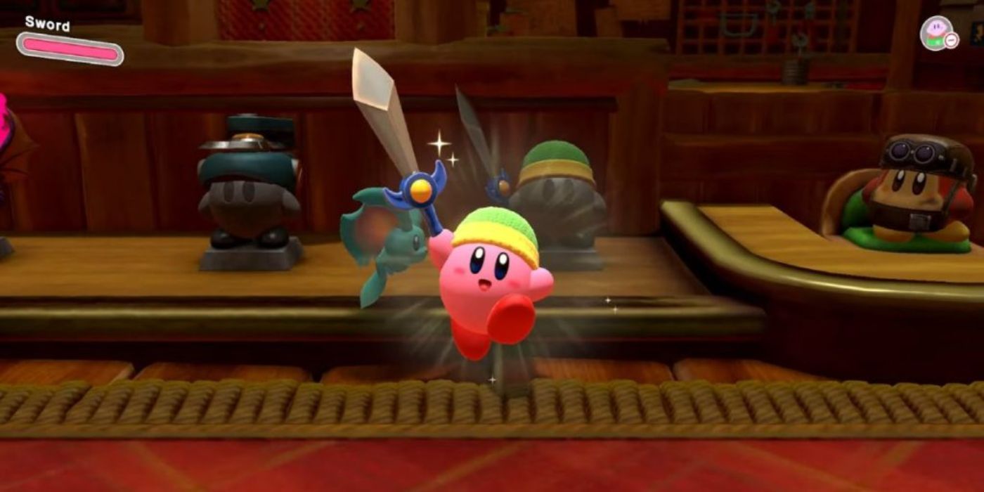 Kirby pula no ar segurando uma espada