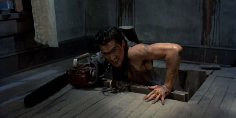 Ash Williams with his chainsaw hand in The Evil Dead 2 movie