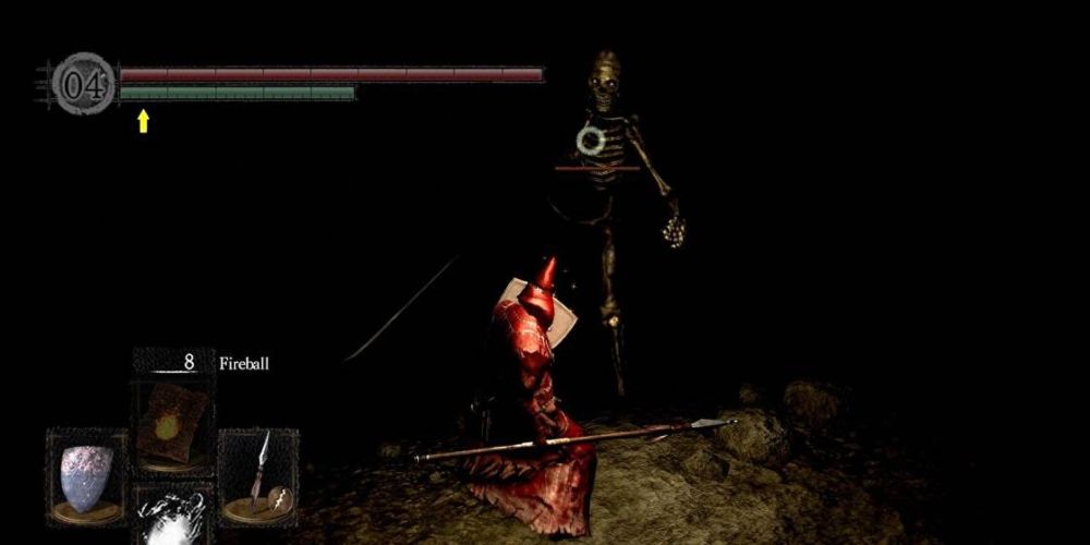 A player fighting a giant skeleton in the Tomb of the Giants Dark Souls