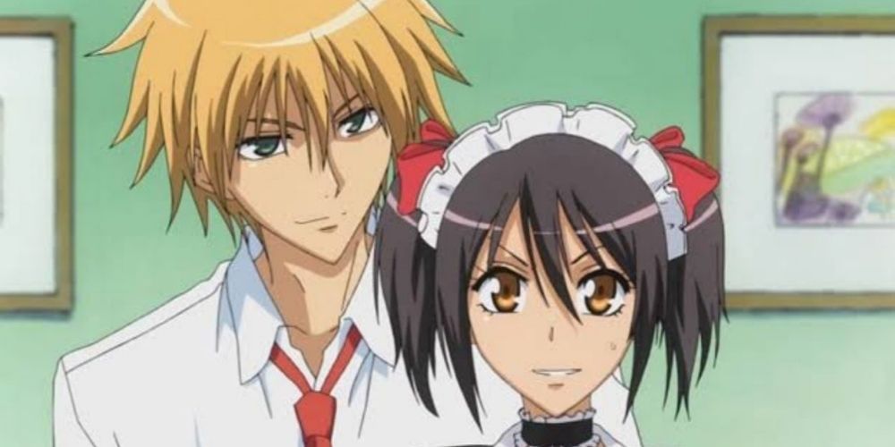 Usui standing behind Misaki in her maid uniform in Maid-Sama