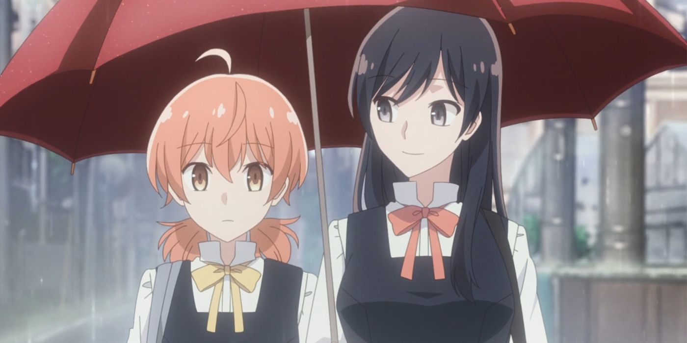 Yuu and Touko sharing an umbrella in Bloom Into You.