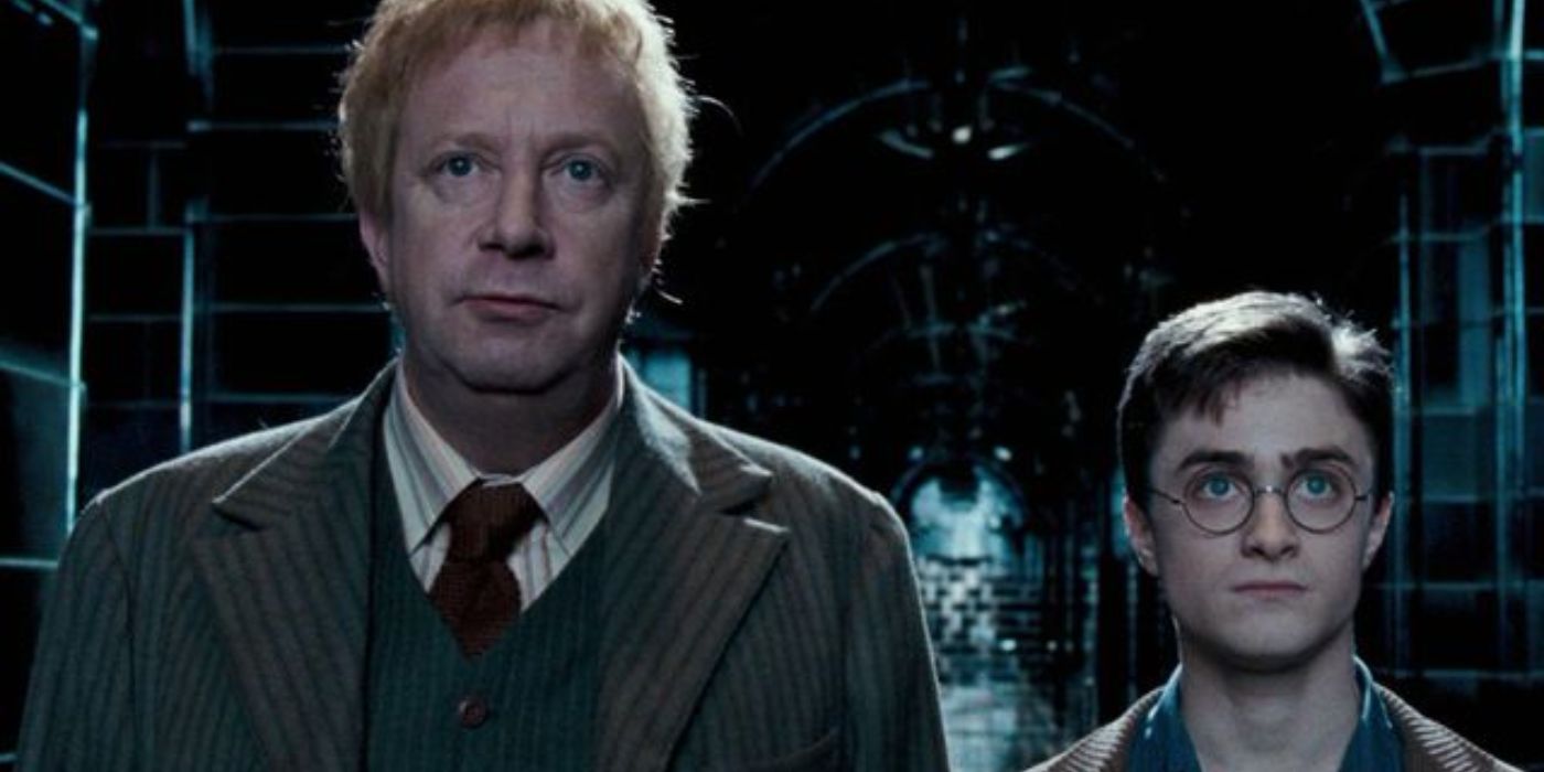 Arthur Weasley standing with Harry Potter in the Ministry of Magic in Harry Potter and the Order of the Phoenix.