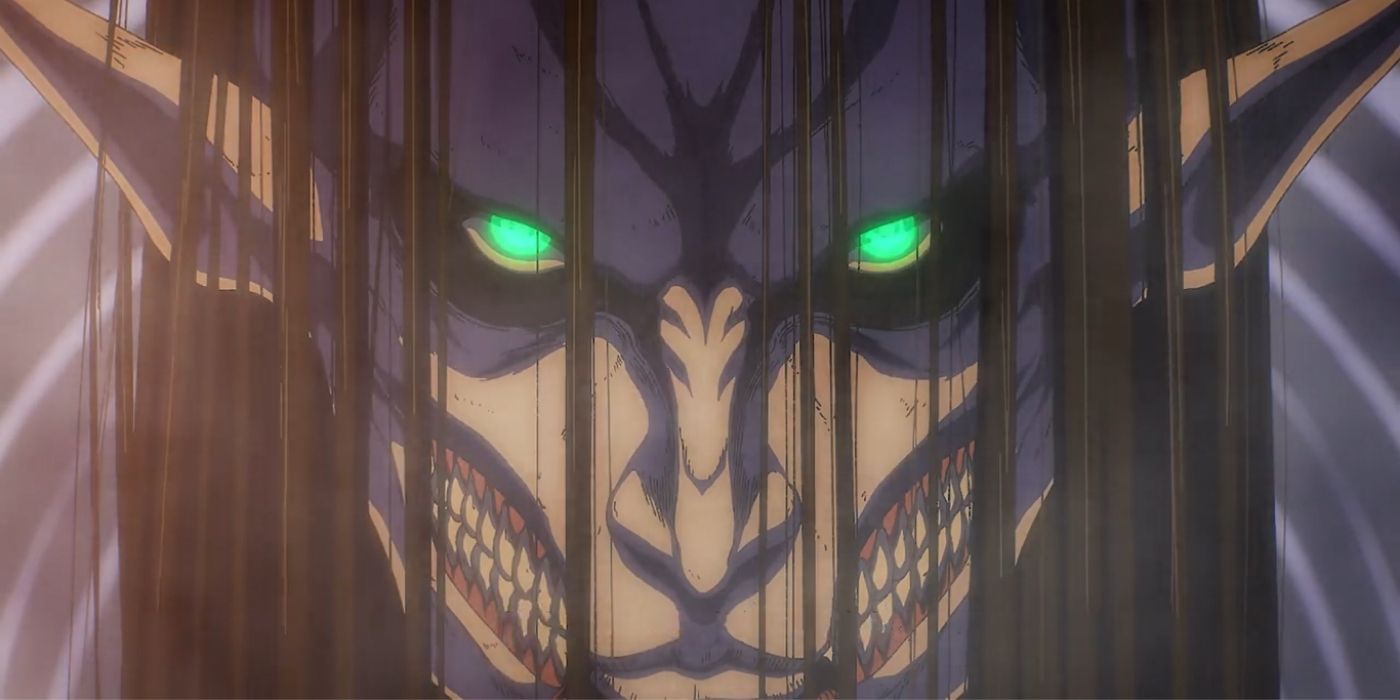 Closeup of Attack on Titan's Eren in a monstrous look with glowing green eyes.