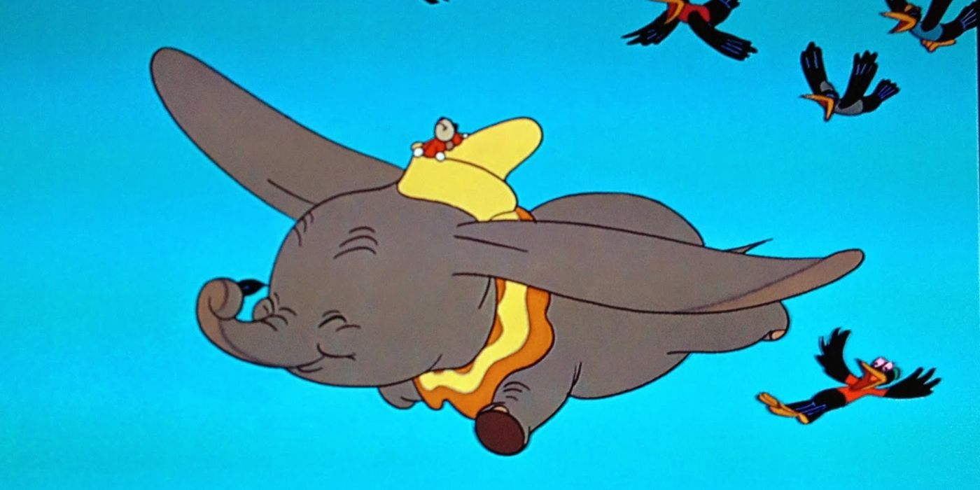 Dumbo flies with Timothy Q. Mouse riding on his hat and the crows following.