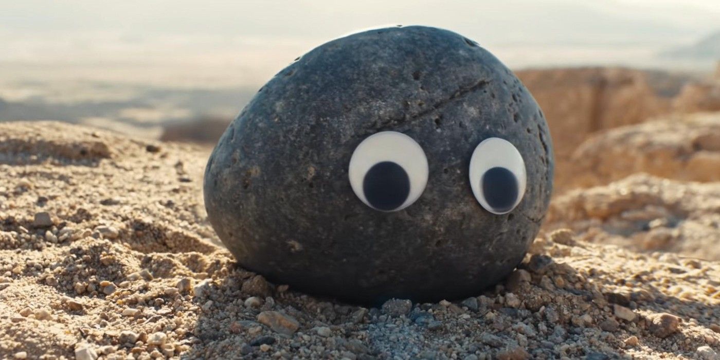 Rock on a beach with googly eyes in Everything Everywhere All At Once