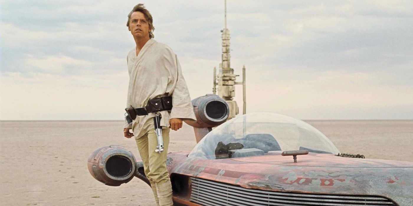 Luke Skywalker standing next to his landspeeder in Star Wars
