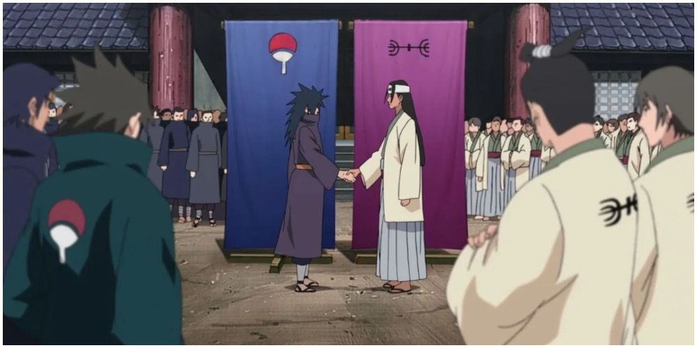 Madara and Hashirama shaking hands to unite their clans.