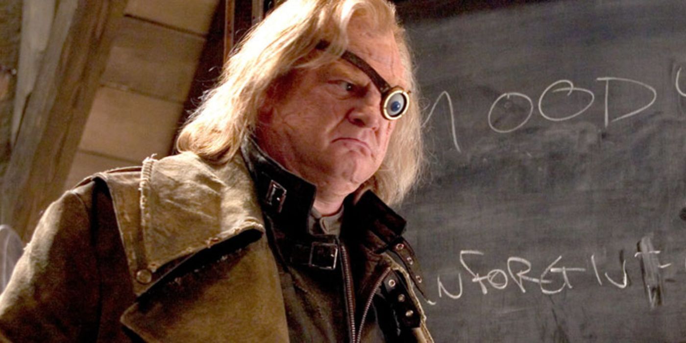 Barty Crouch Jr. disguised as Mad-Eye Moody standing in front of a blackboard in Harry Potter