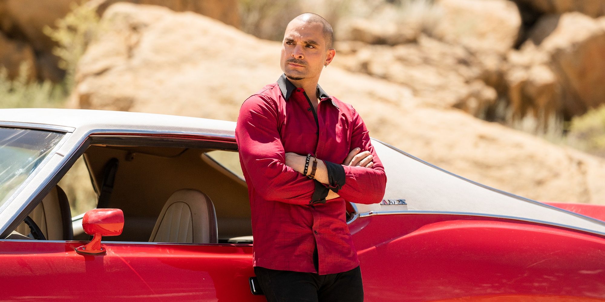 Michael Mando as Nacho Varga standing in front of his car in Better Call Saul