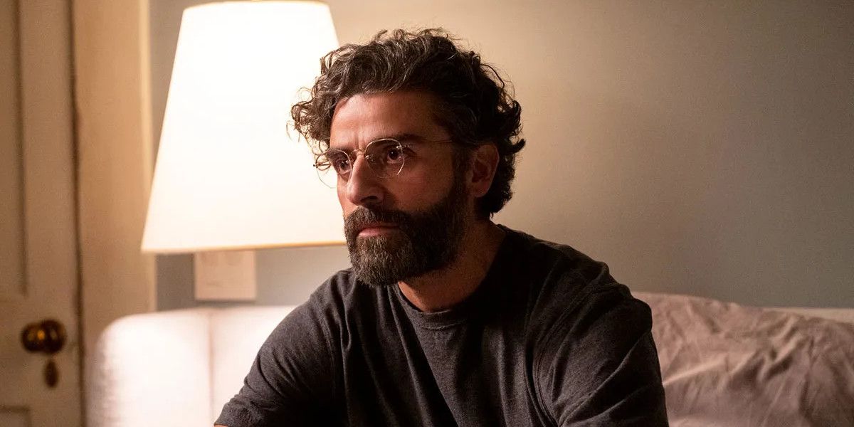 Oscar Isaac usando óculos na cama em Cenas de um Casamento.