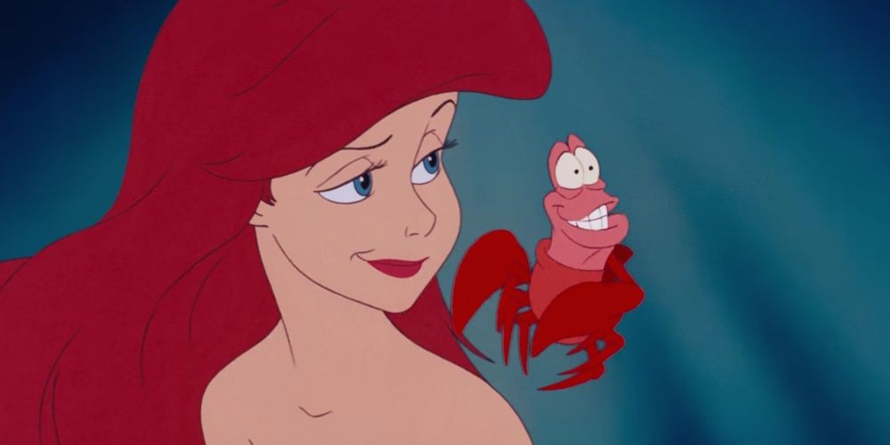 Sebastian swimming by Ariel's ear and explaining the joys of the ocean