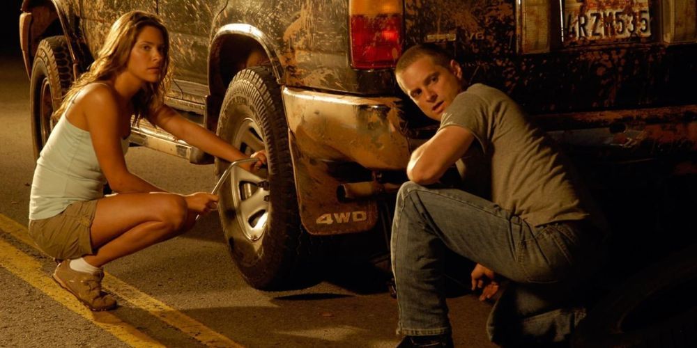 Jill Wagner and Shea Whigham changing a tire in Splinter