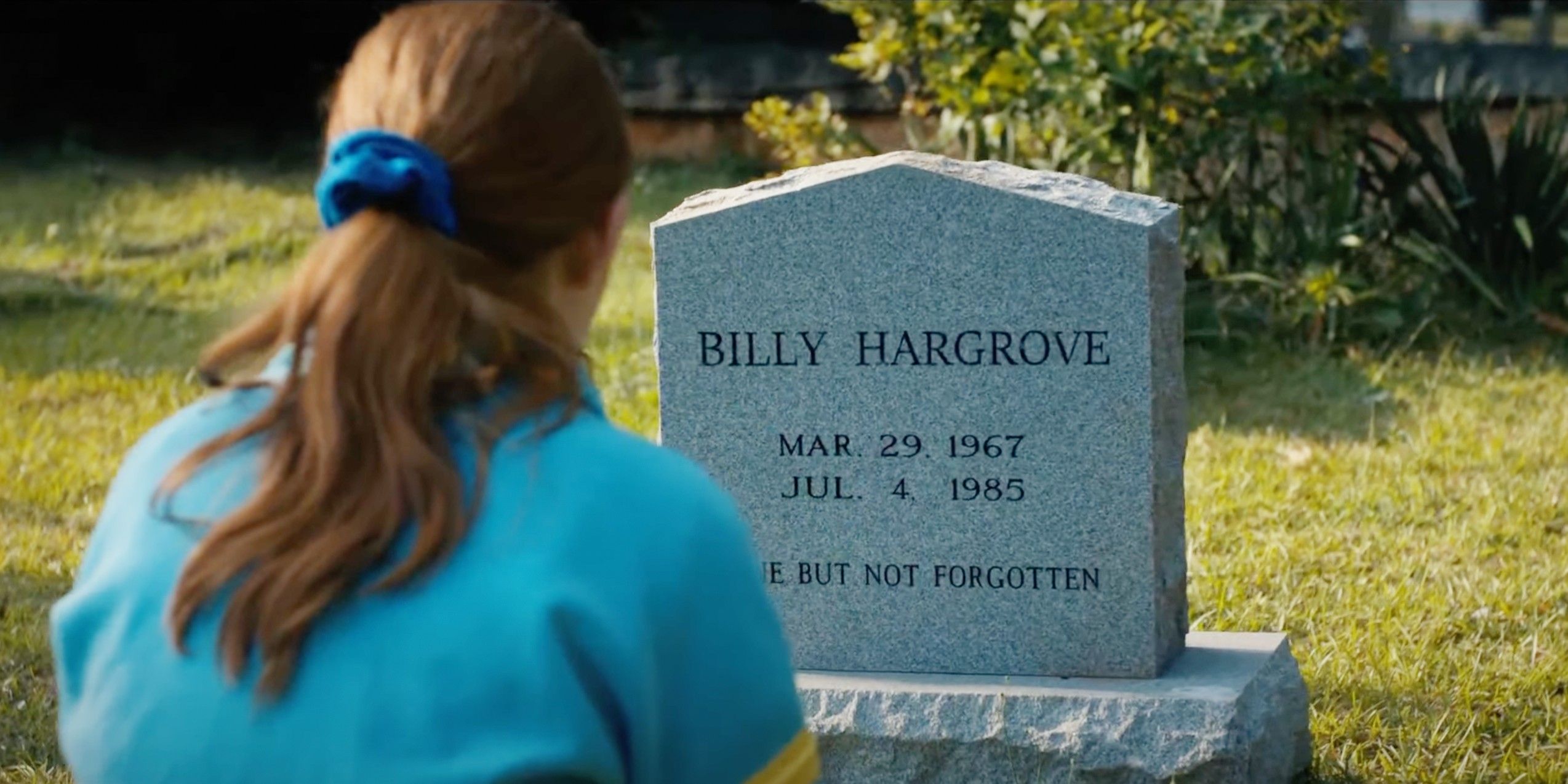 Max sits at Billy's grave, which reads "Billy Hargrove Mar. 29, 1967 - Jul. 4, 1985 Gone But Not Forgotten."
