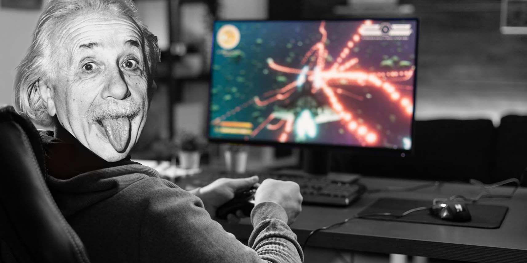 Albert Einstein makes a silly face while playing video games on a PC