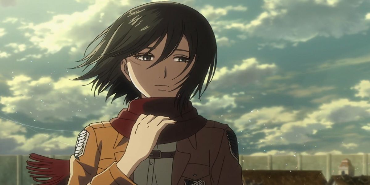 Mikasa holding her scarf in Attack On Titan.