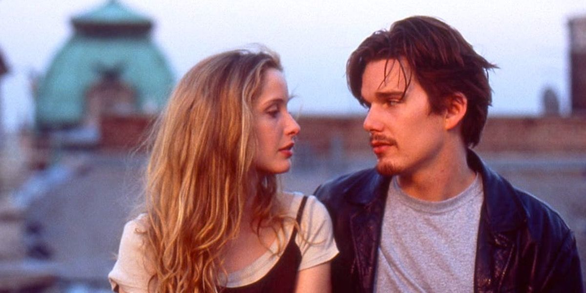 Celine and Jesse looking at each other on a rooftop in Before Sunrise