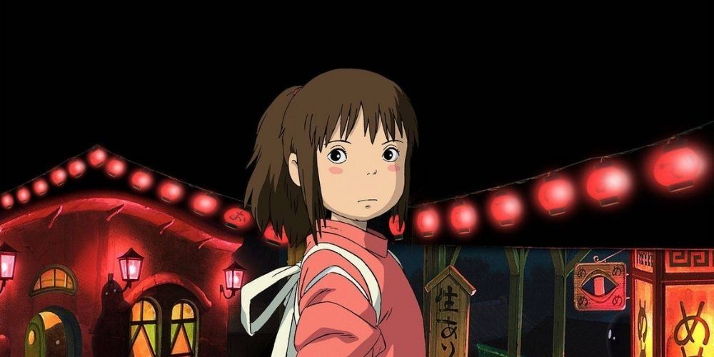 Chihiro from Spirited Away frowning in front of red lanterns.
