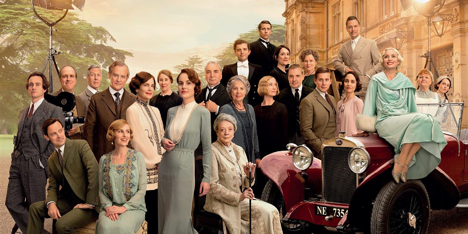 The cast of Downton Abbey: A New Era pose in front of the titular castle.