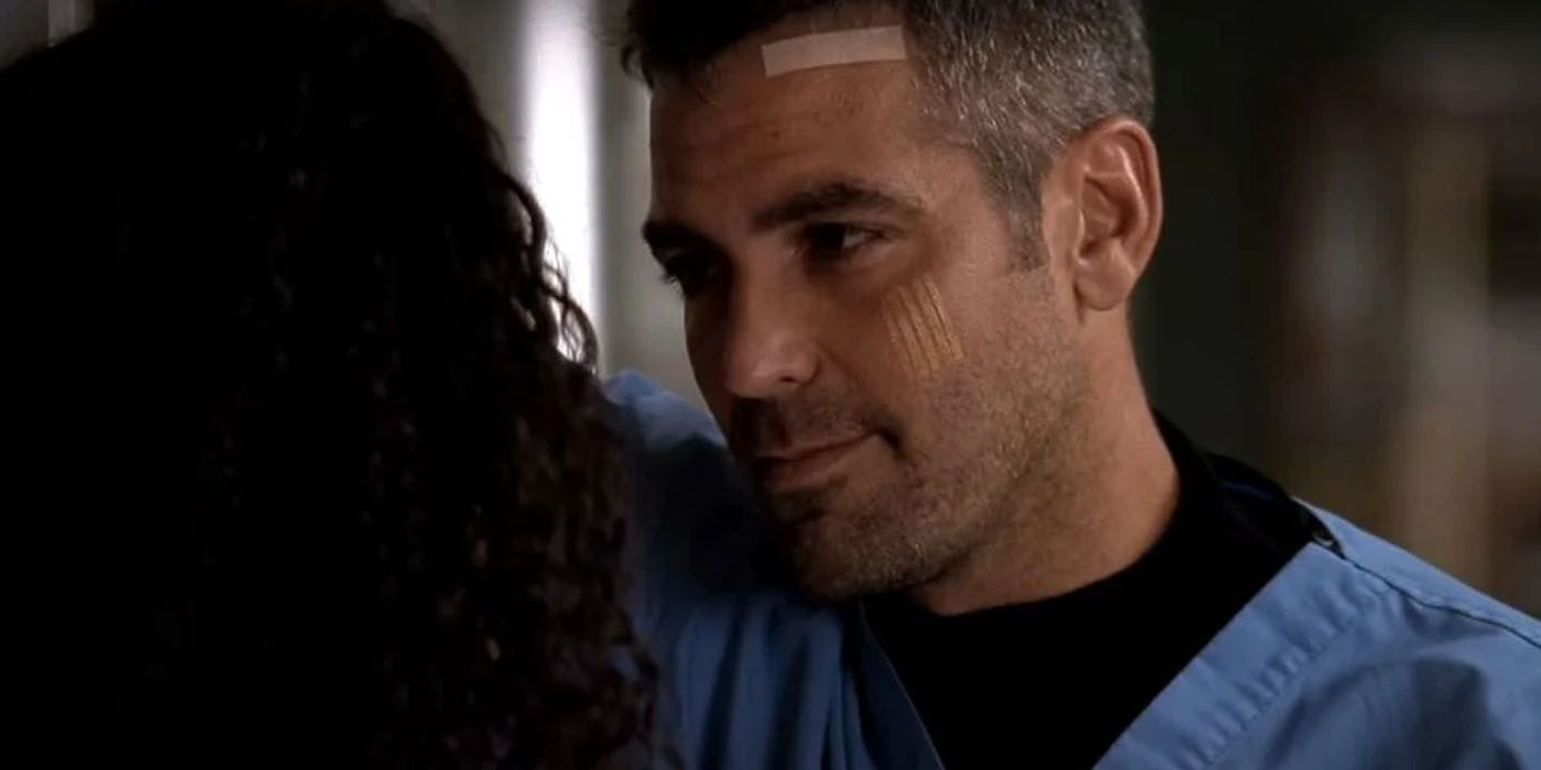 ER's George Clooney as Dr. Doug Ross standing in front of Nurse Carol Hathaway