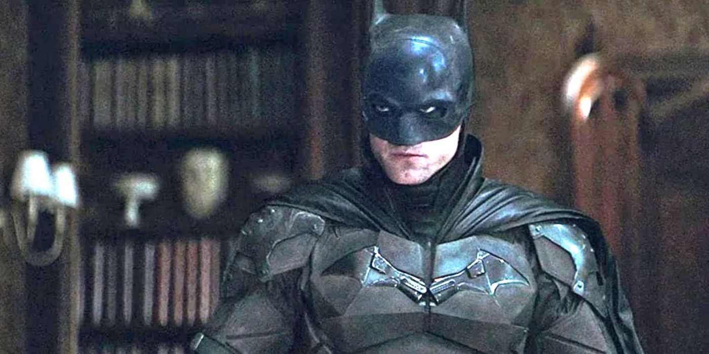 In a still from The Batman (2022), Batman surveys an upscale Gotham apartment.