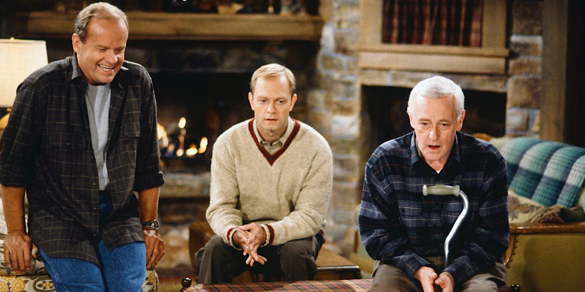 Frasier, Niles, and Martin watching TV in their cabin in Frasier