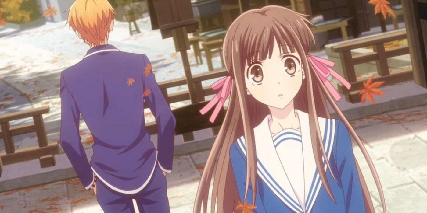 Tohru from Fruits Basket looking concerned next to Kyo, who is looking the other way