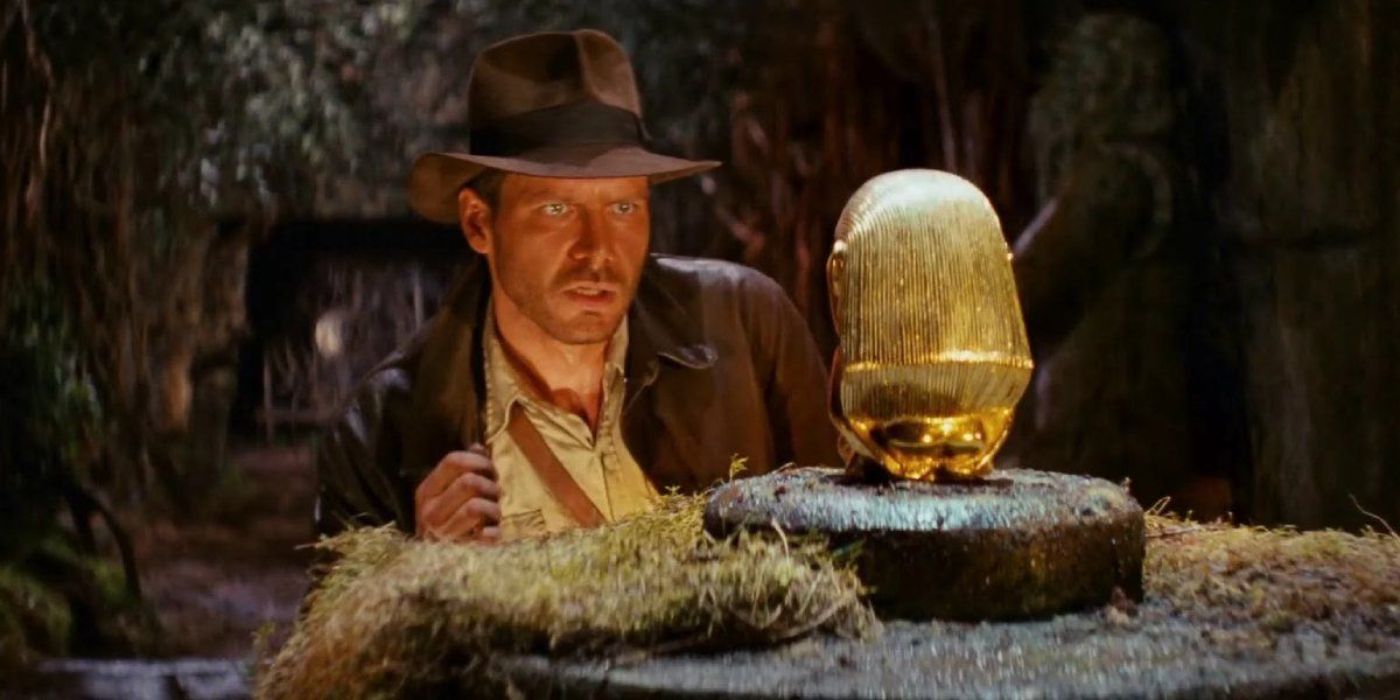 Indiana Jones reaches for the golden statue in Raiders of the Lost Ark.