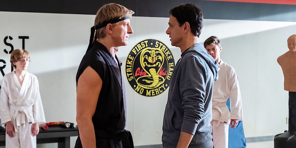 Johnny and Daniel staring at each other in the dojo - Cobra Kai