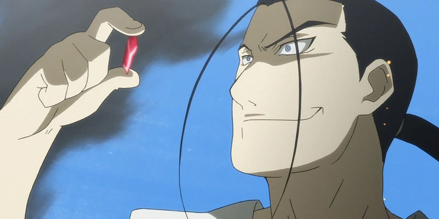 Kimblee looking at a philosophers stone in Fullmetal Alchemist.