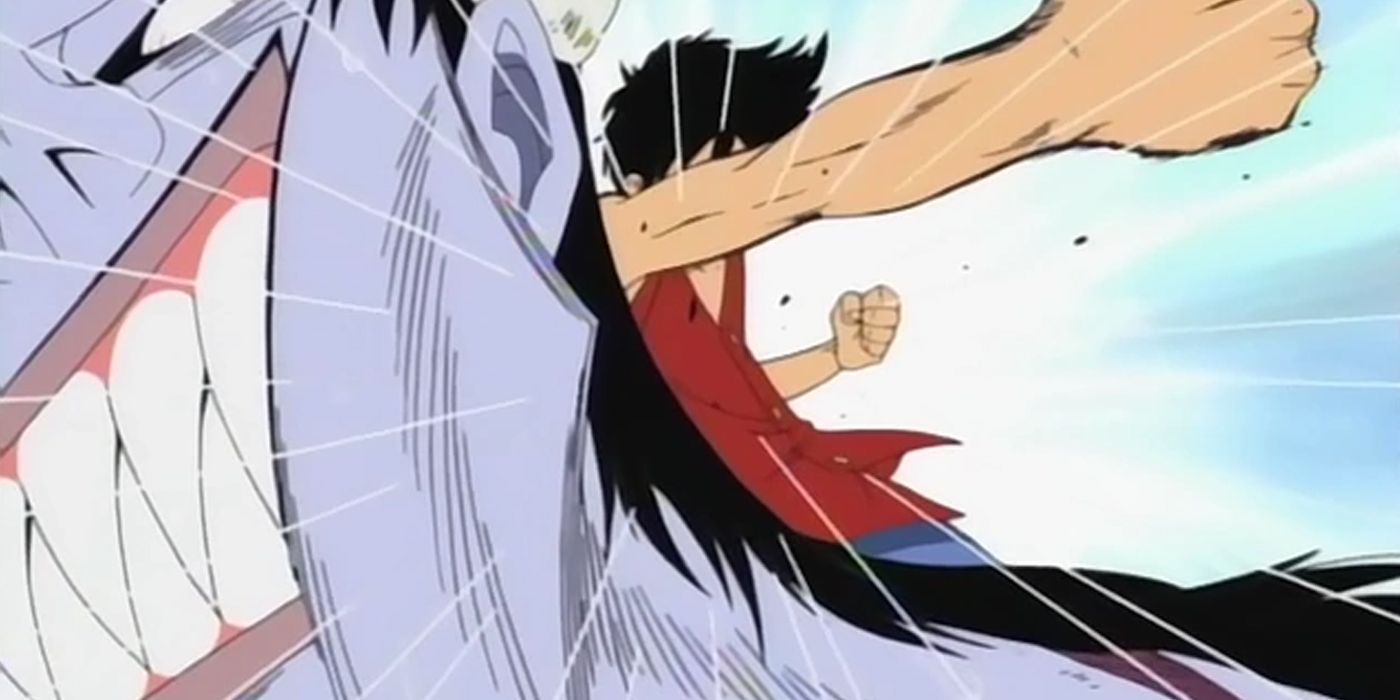 Luffy punches Arlong in One Piece
