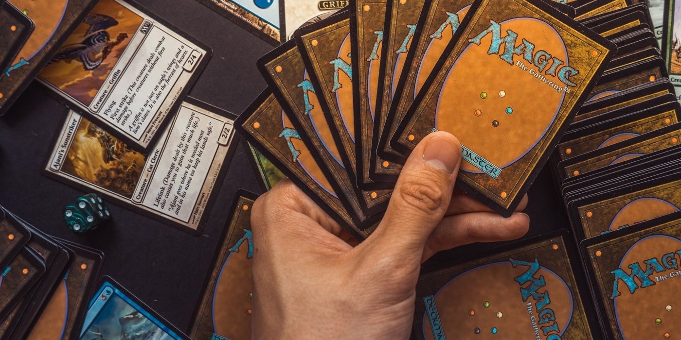 Magic: The Gathering cards in hand