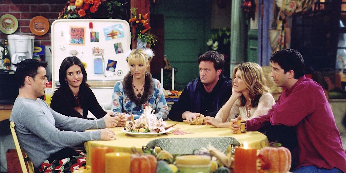 Monica, Phoebe, Chandler, Rachel, Ross, and Joey sitting around the table - Friends.