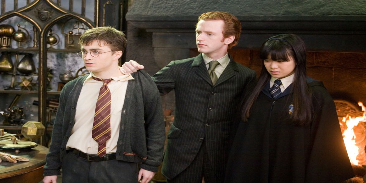 Percy Weasley holds Harry Potter and Cho Chang by Harry Potter and the Order of Phoenix.