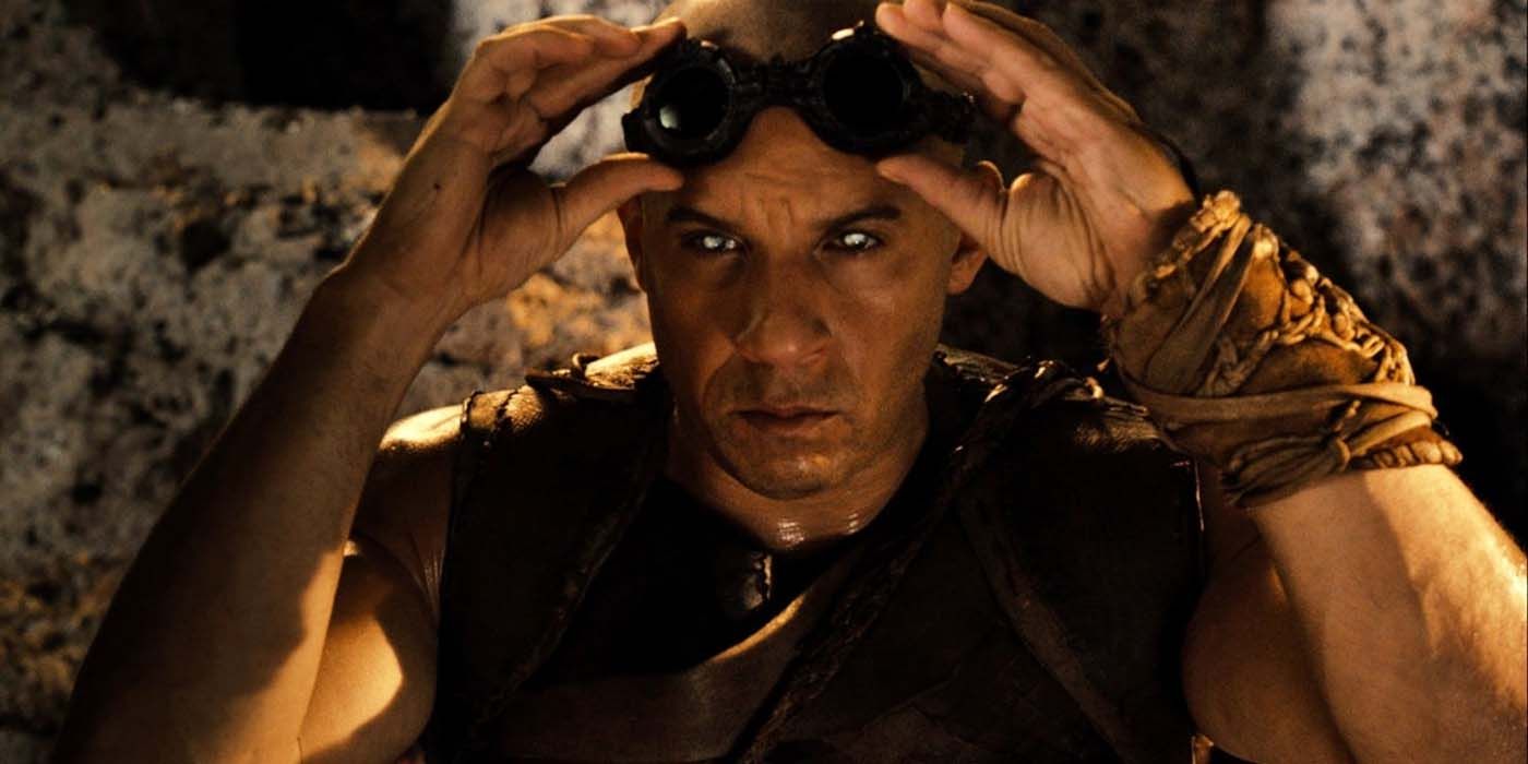 Vin Diesel puts on his goggles in The Chronicles of Riddick