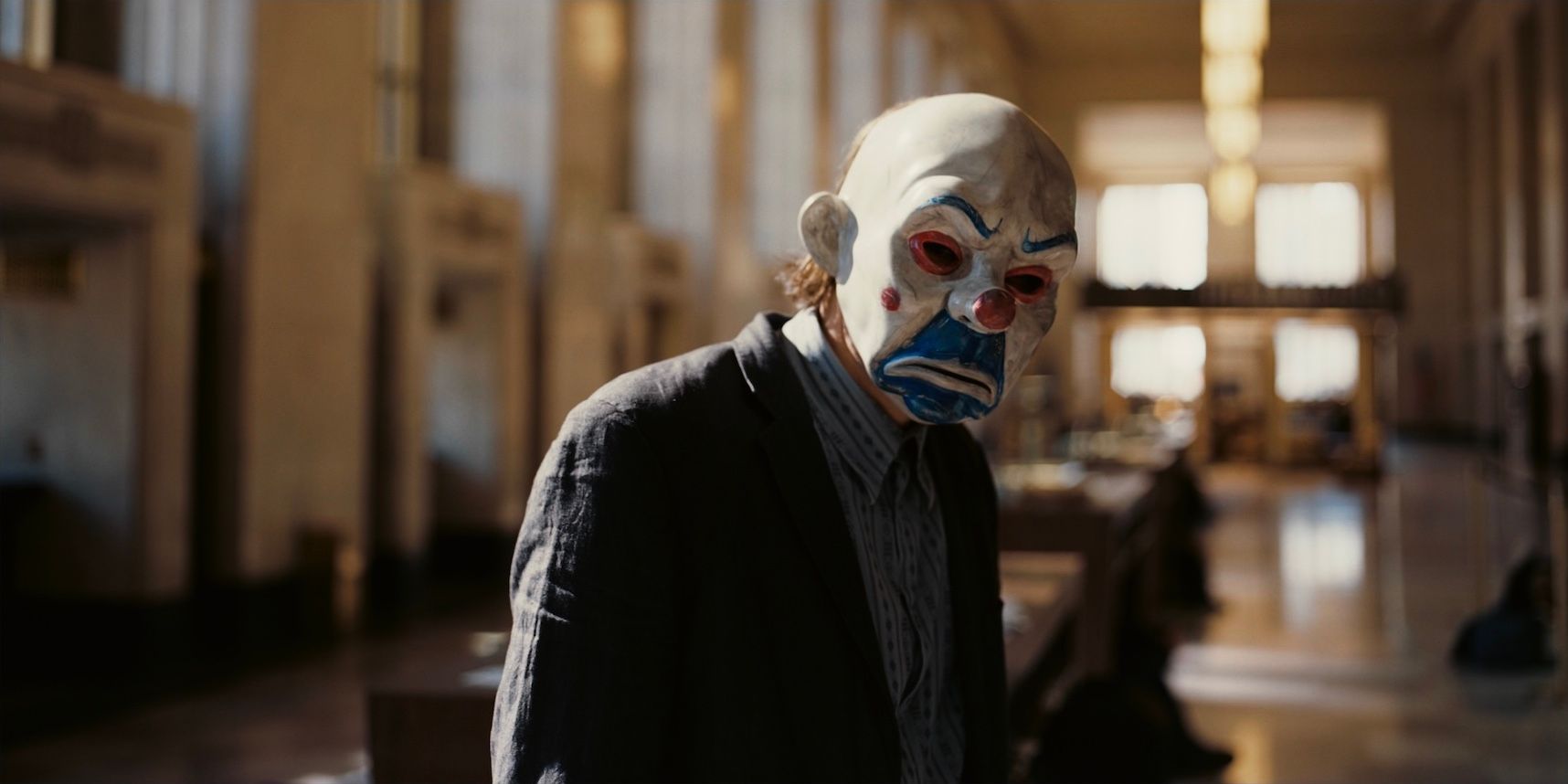 The Joker robs a bank in The Dark Knight (2008).