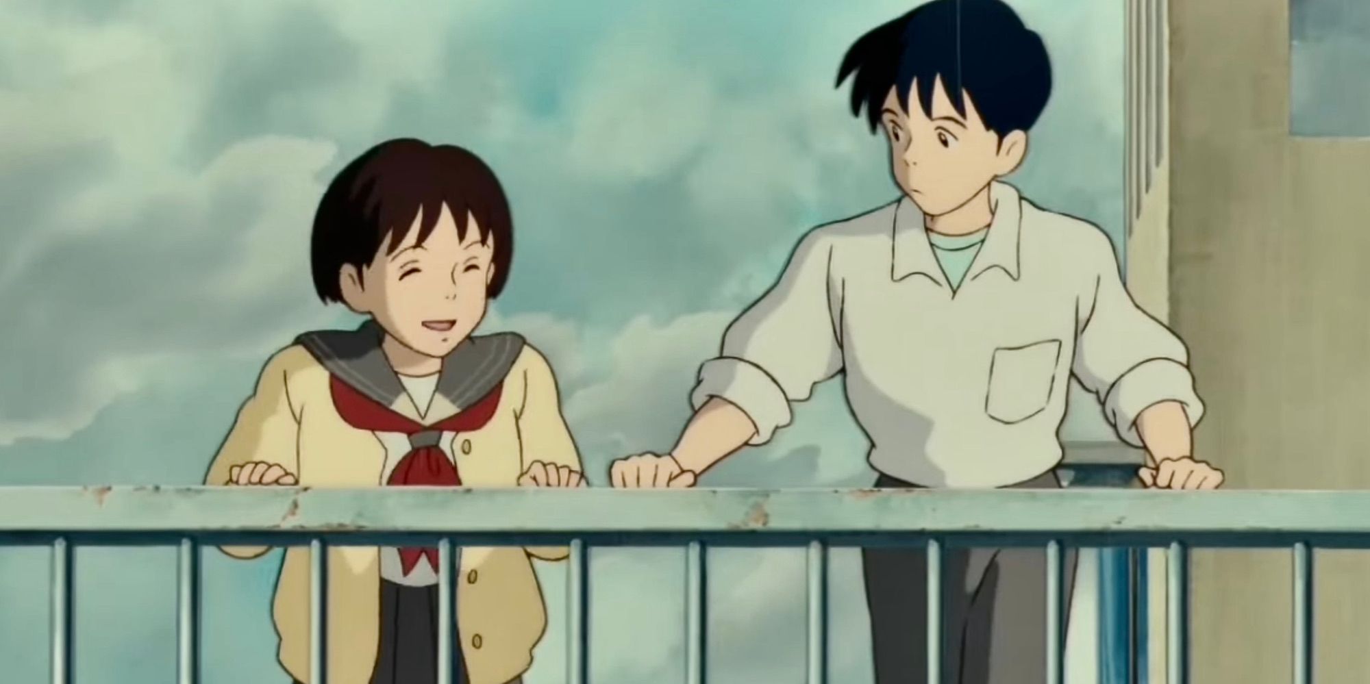 Shizuku and Seiji talking on a rooftop in Whisper of the Heart.