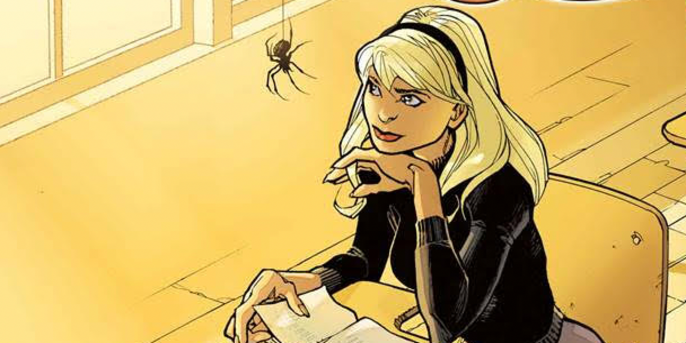 Gwen Stacy staring lovingly at a spider while sitting on her desk and reading a book