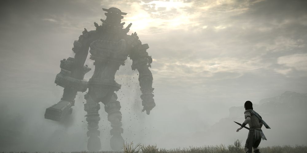 Wander facing off against a distant Colossus in Shadow of the Colossus game