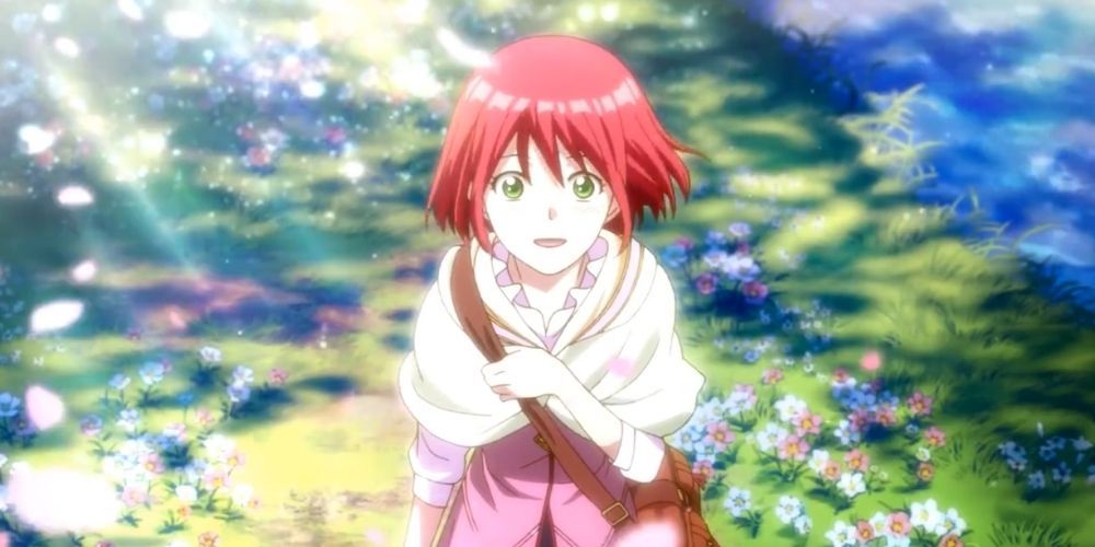 Shirayuki smiles and looks up at the sky in a field of flowers in Snow White with her red hair.