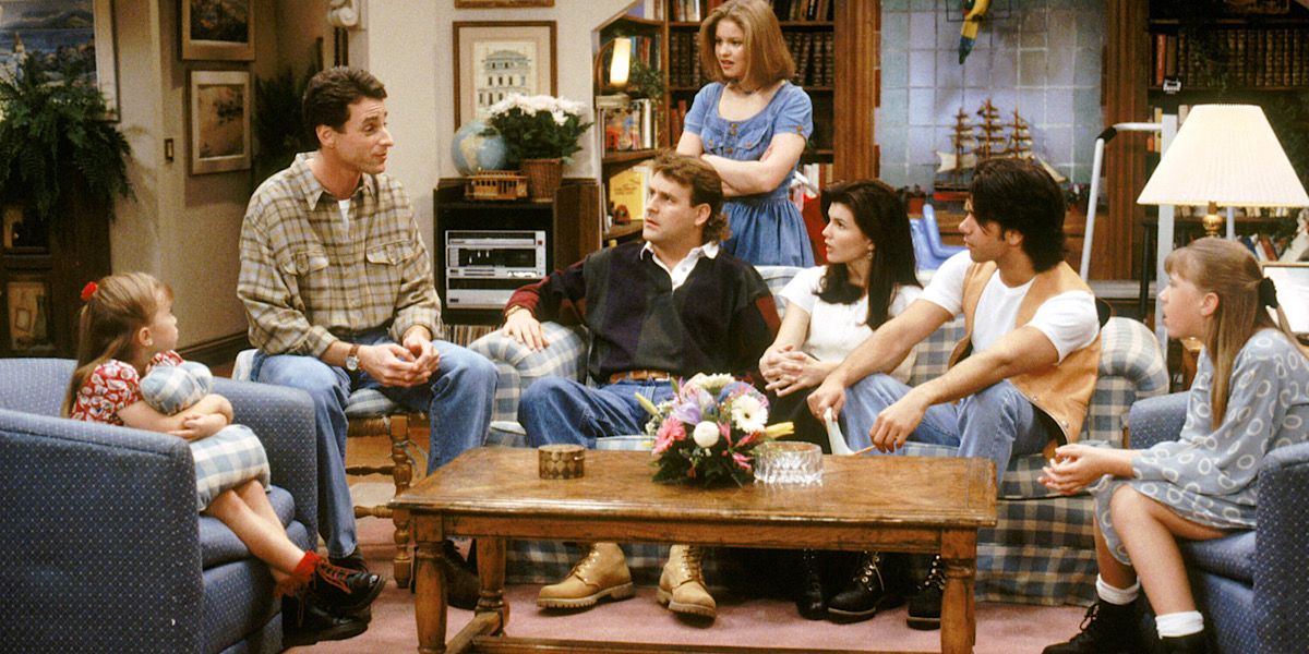 The family sitting in their living room talking - Full House