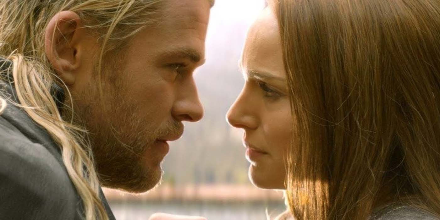 Thor (Chris Hemsworth) and Jane (Natalie Portman) get close to each others' faces in Thor: The Dark World (2013).