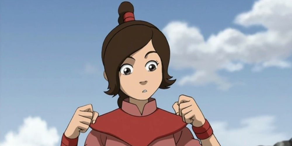 Ty Lee from Avatar: The Last Airbender looks at her hands.