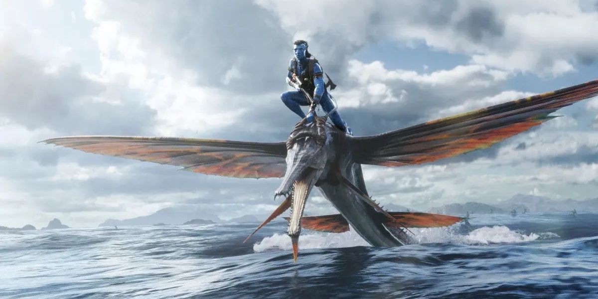 Navi and a water creature ride the waves in Avatar 2: The Way of Water.