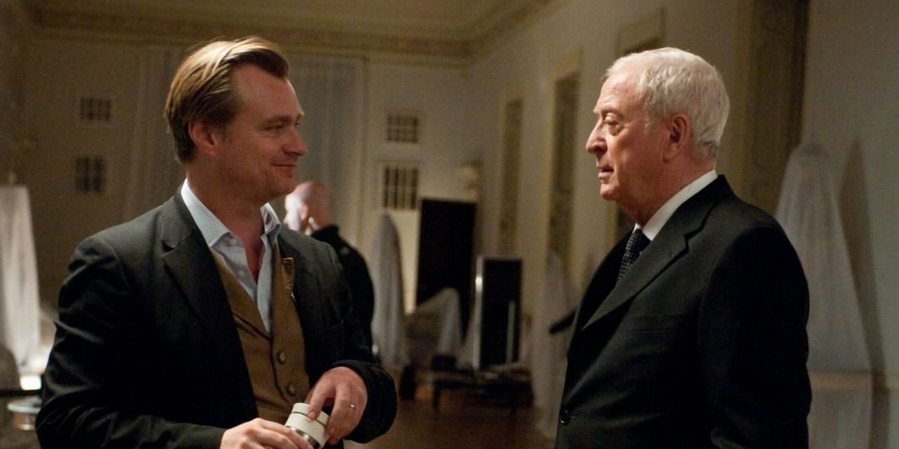 christopher nolan and michael caine chat on the set of the dark knight