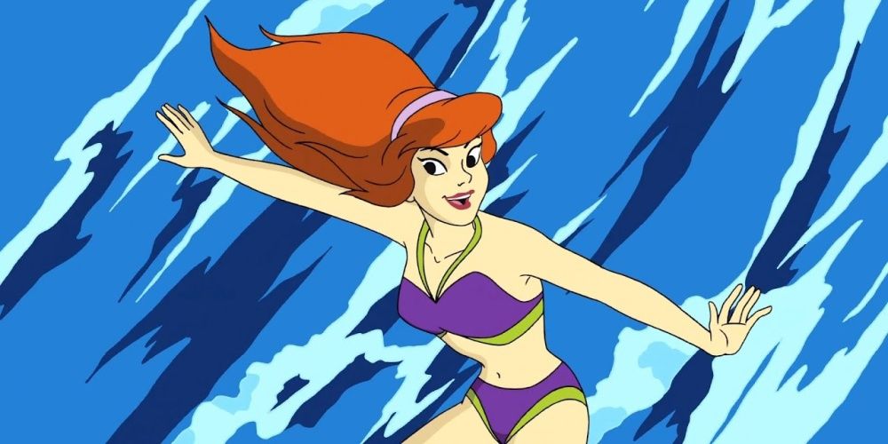 Daphne from Scooby-Doo surfing a wave.