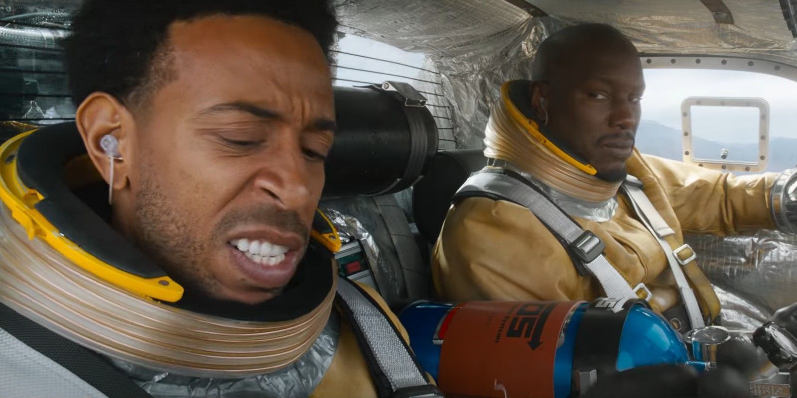 Roman and Tej prepare their space car in Fast and Furious 9