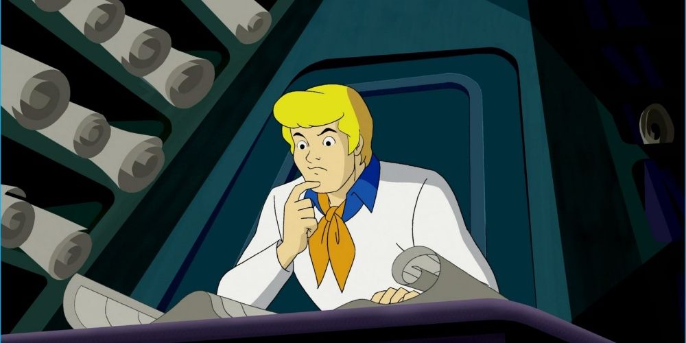 Scooby-Doo's Fred studying a document