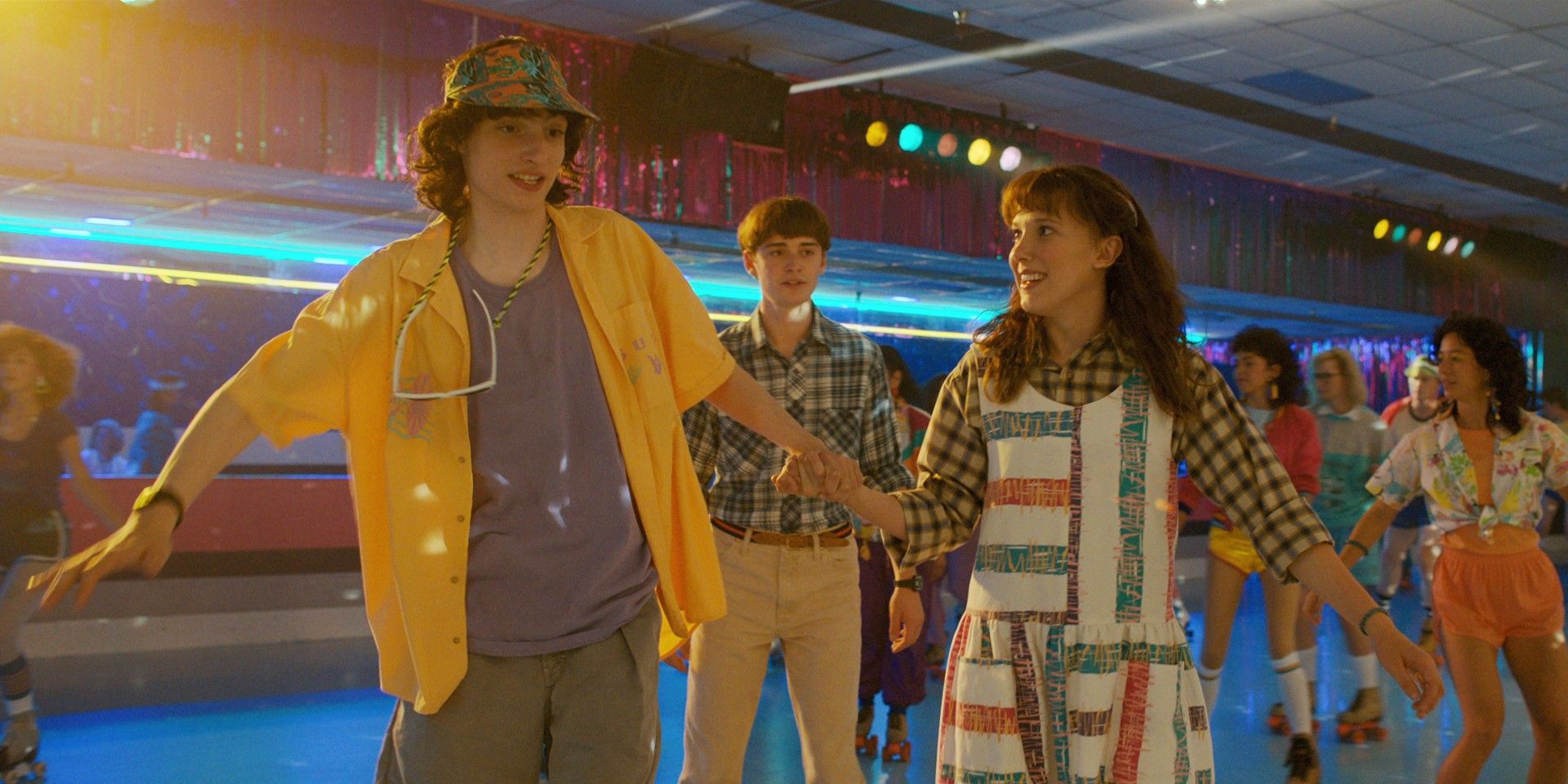 Mike Wheeler, El Hopper, and Eleven in Stranger Things