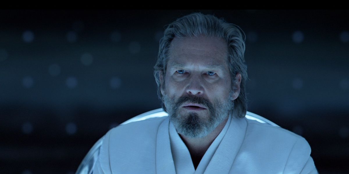 Kevin Flynn sitting at his table in Tron: Legacy